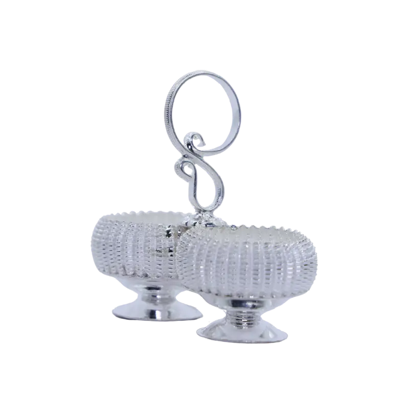 Twin silver basket bowls joined by a swirled carrying handle