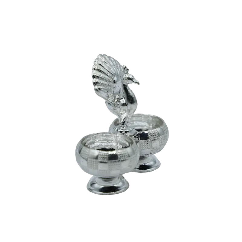 Silver twin bowls with a peacock figure perched between them